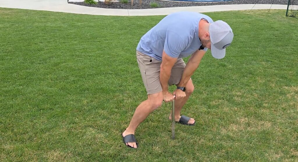 how to use a soil core sampler in dry grass